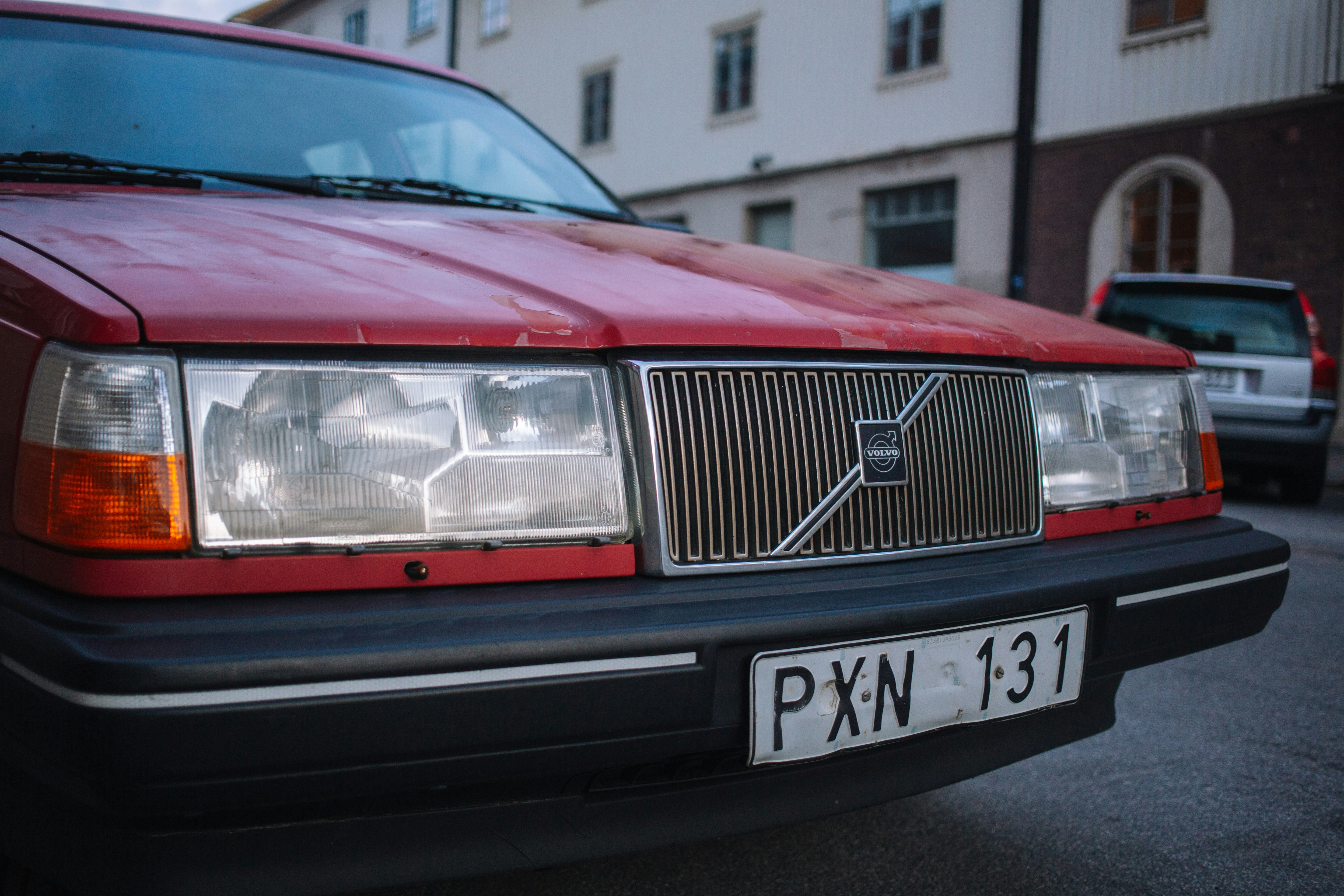 red car on road during daytime