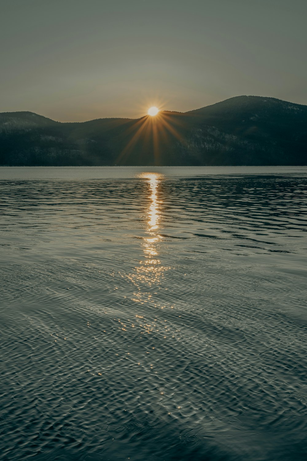 body of water during sunset