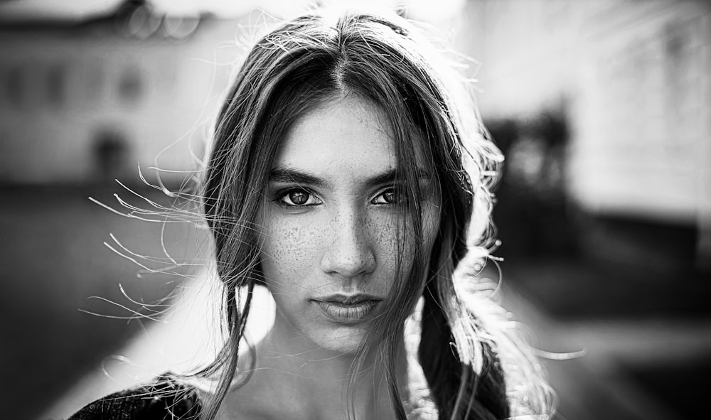 grayscale photo of woman in black and white shirt