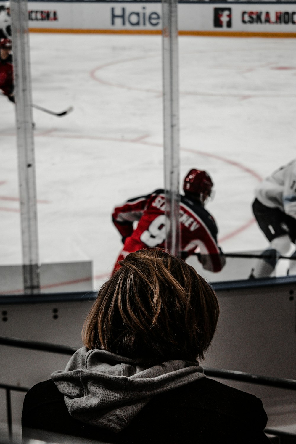 people riding on ice hockey field during daytime