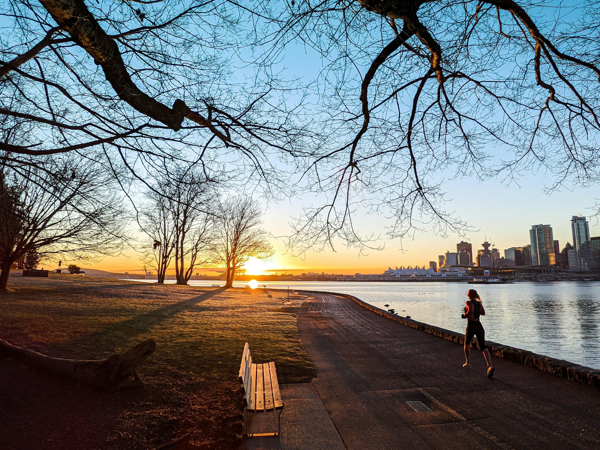 Weekend Run Jog With Sunrise Overlooking Vancouver Downtown Female Running Woman Running at Stanley Park Surrounded With Nature