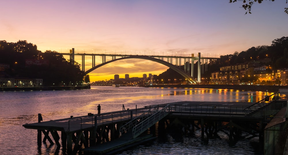 white and black bridge over body of water during daytime