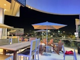 Outdoor patio space featuring modern seating and ambient evening lighting.