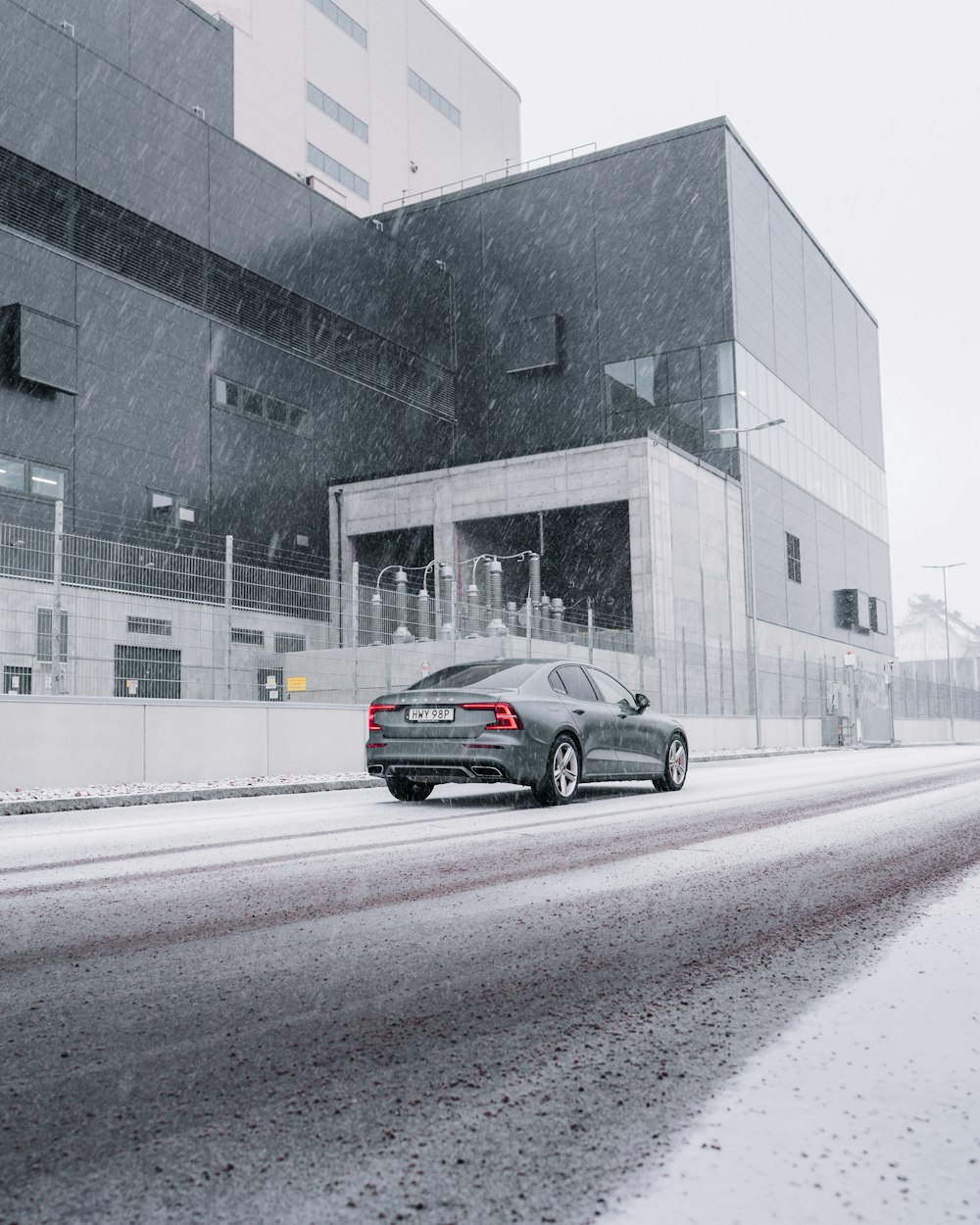 black sedan on road during daytime