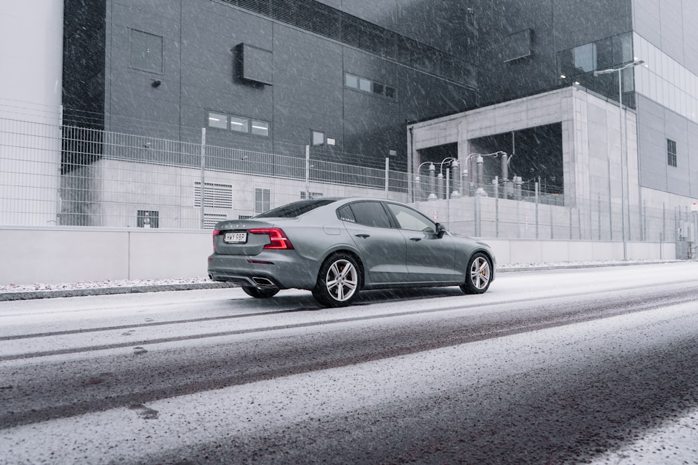 gray sedan on road during daytime