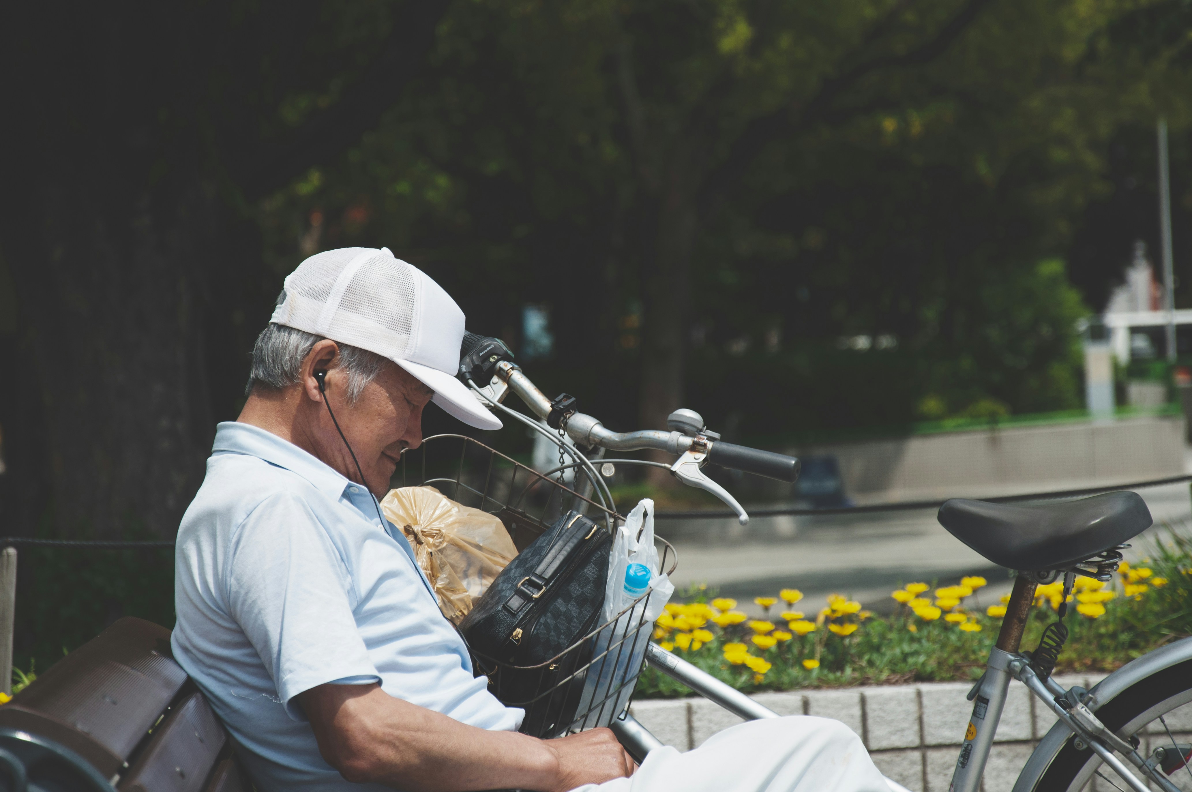 man in white shirt sitting on blue motorcycle during daytime