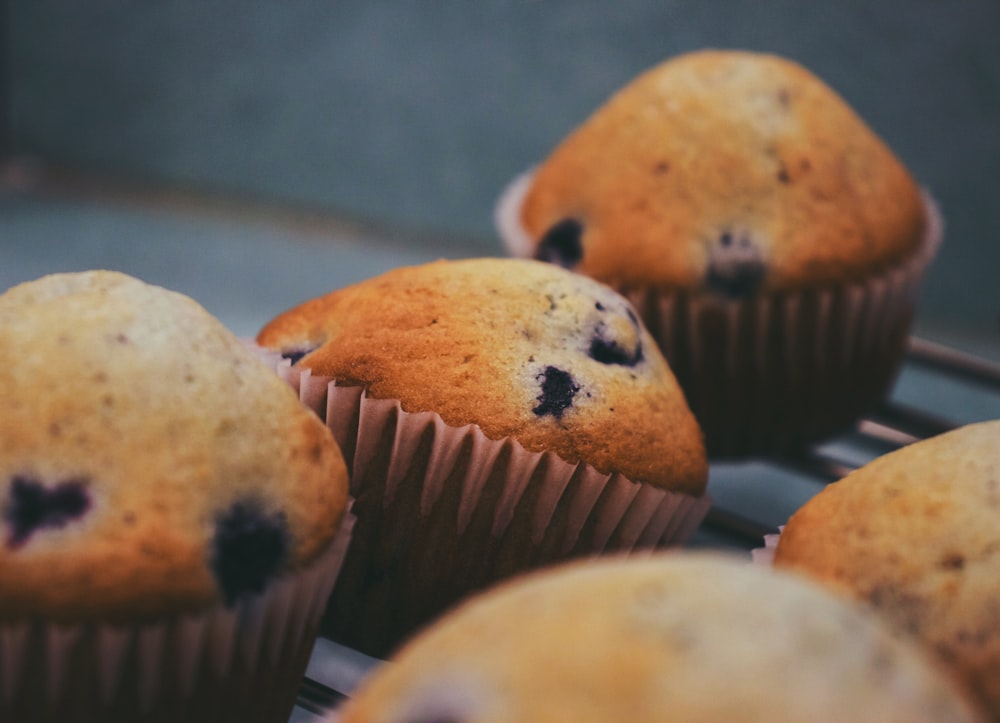 brown cupcakes on black table