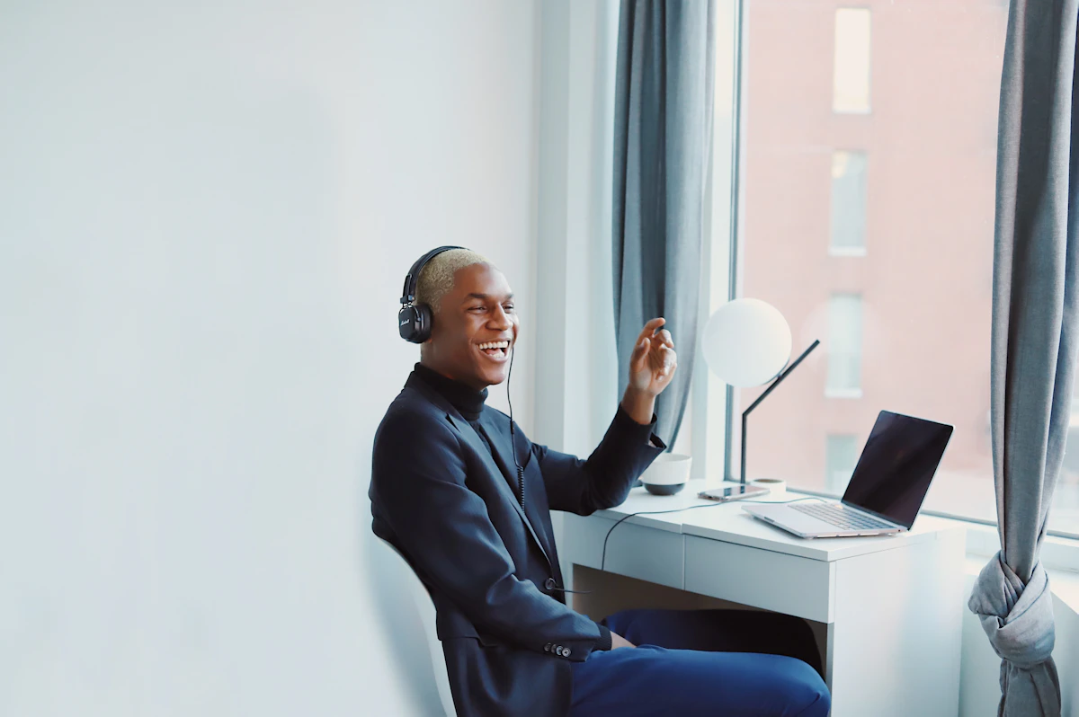 A team member responding to a message on a laptop