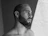 grayscale photo of topless man