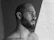grayscale photo of topless man