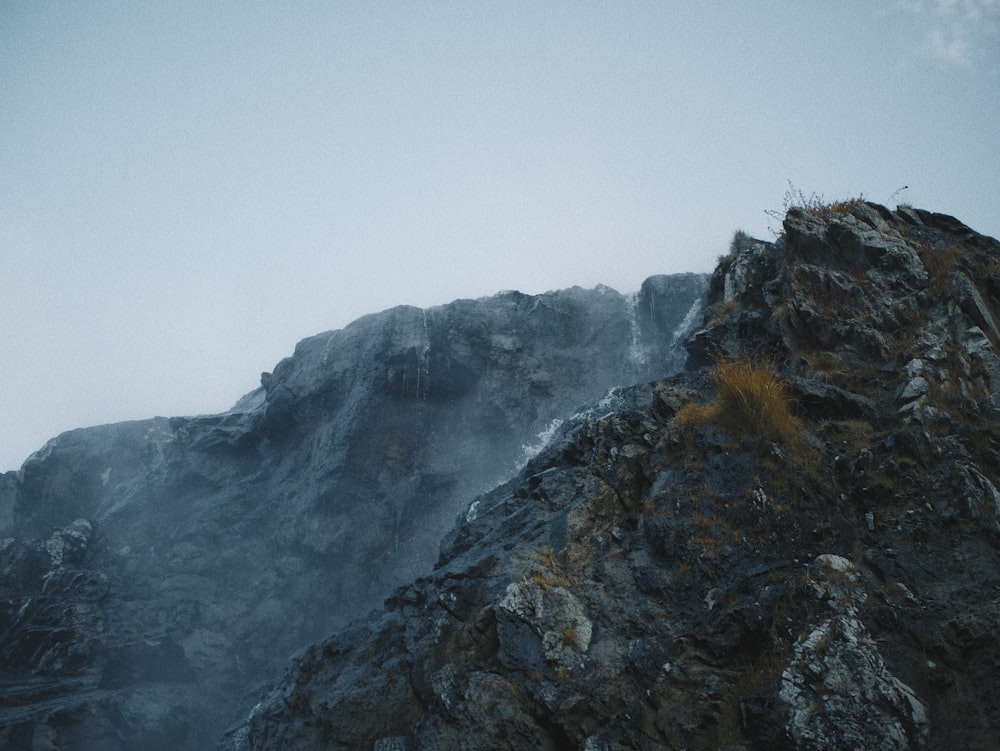 gray and green mountain under white sky during daytime