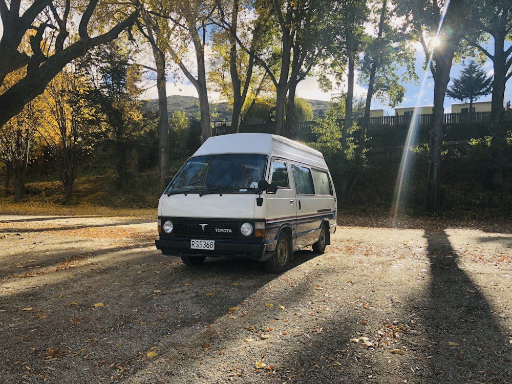 white van parked on road side during daytime