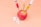 red apple fruit beside clear plastic bottle