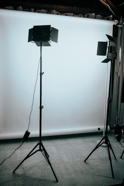 black and gray tripod stand
