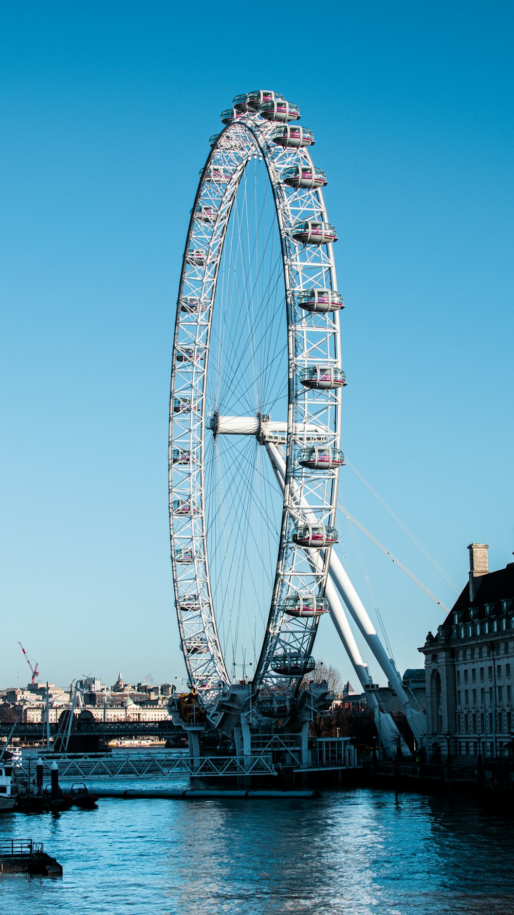 white ferris wheel under blue sky during daytime