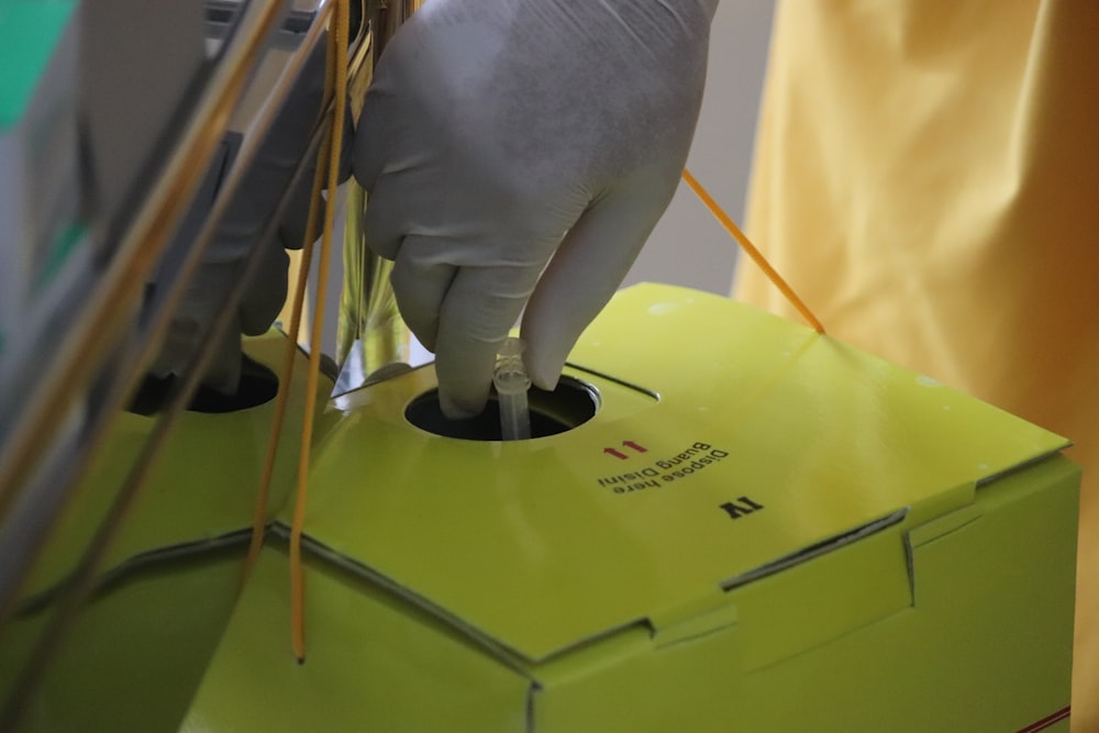 yellow and black plastic container