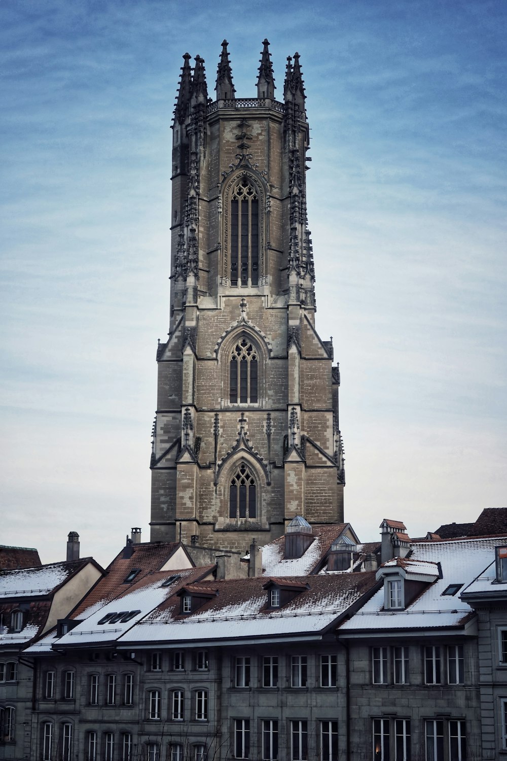 brown concrete church under white sky during daytime