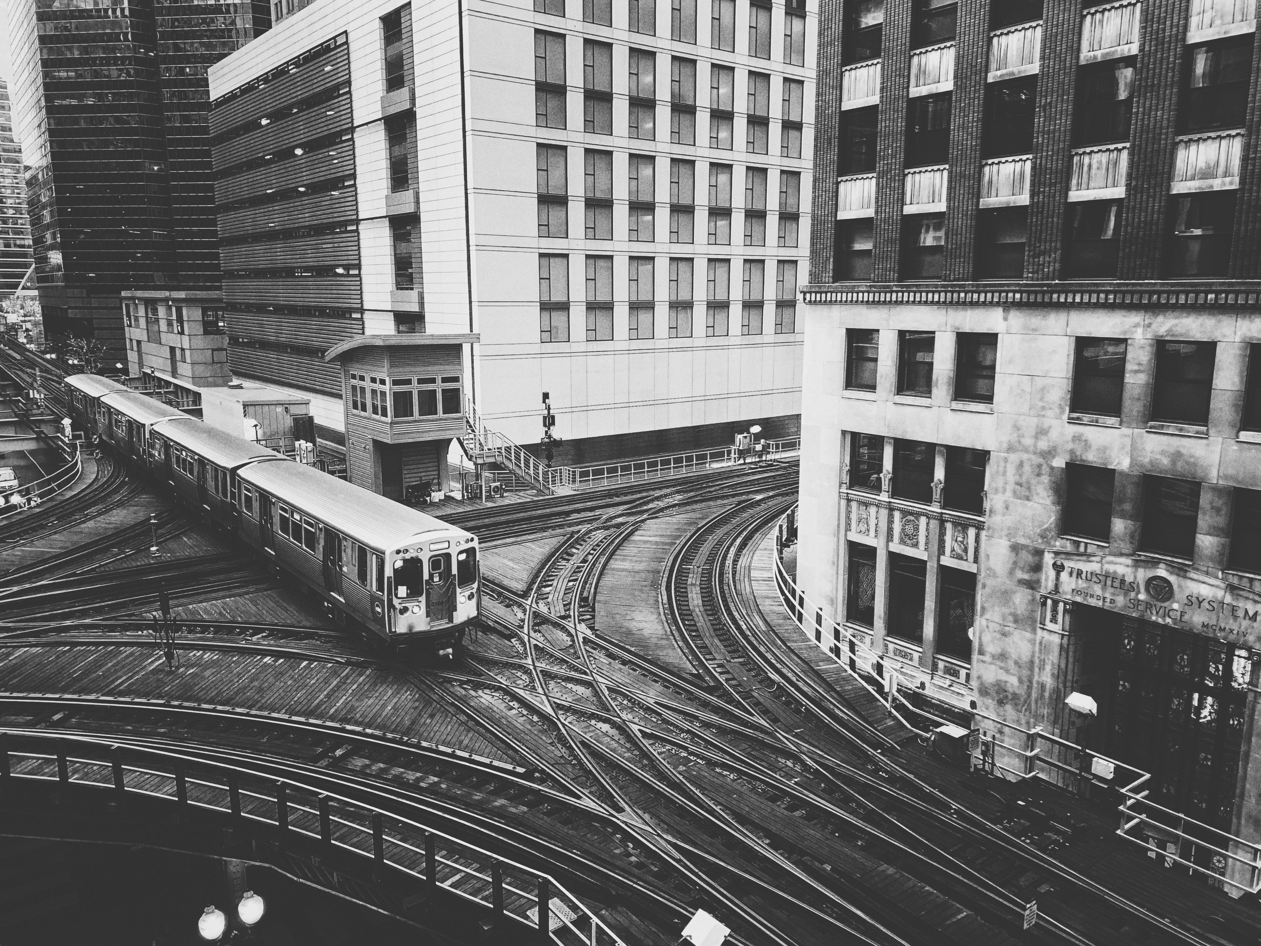 grayscale photo of train near building, Chicago CTA