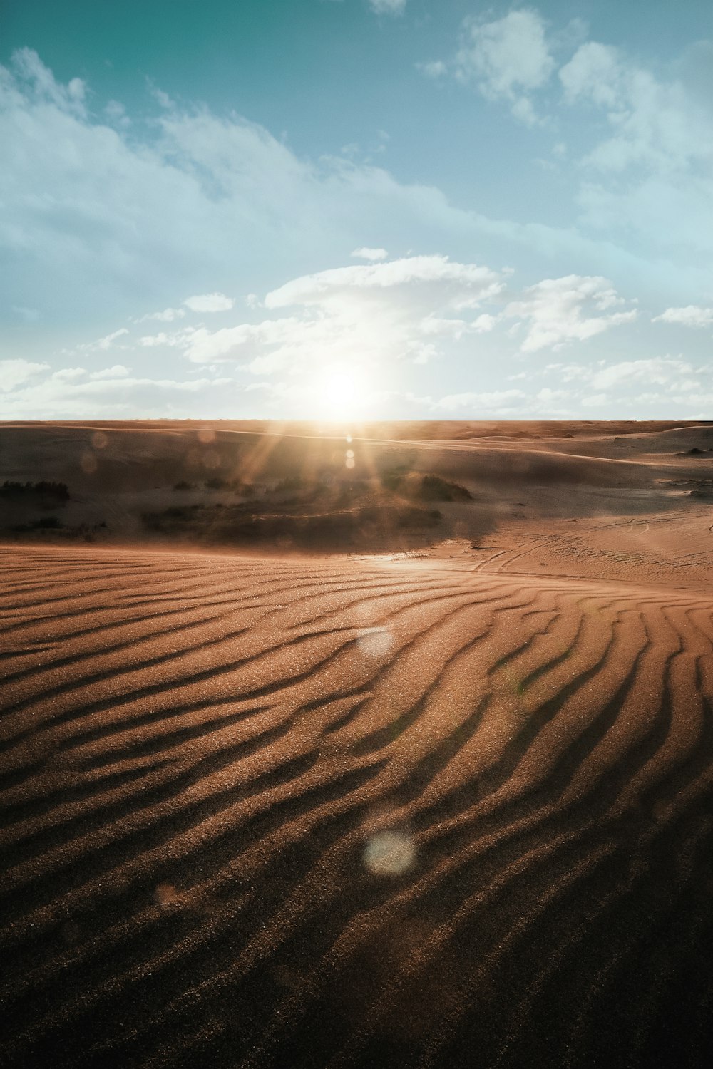 brown sand under blue sky during daytime