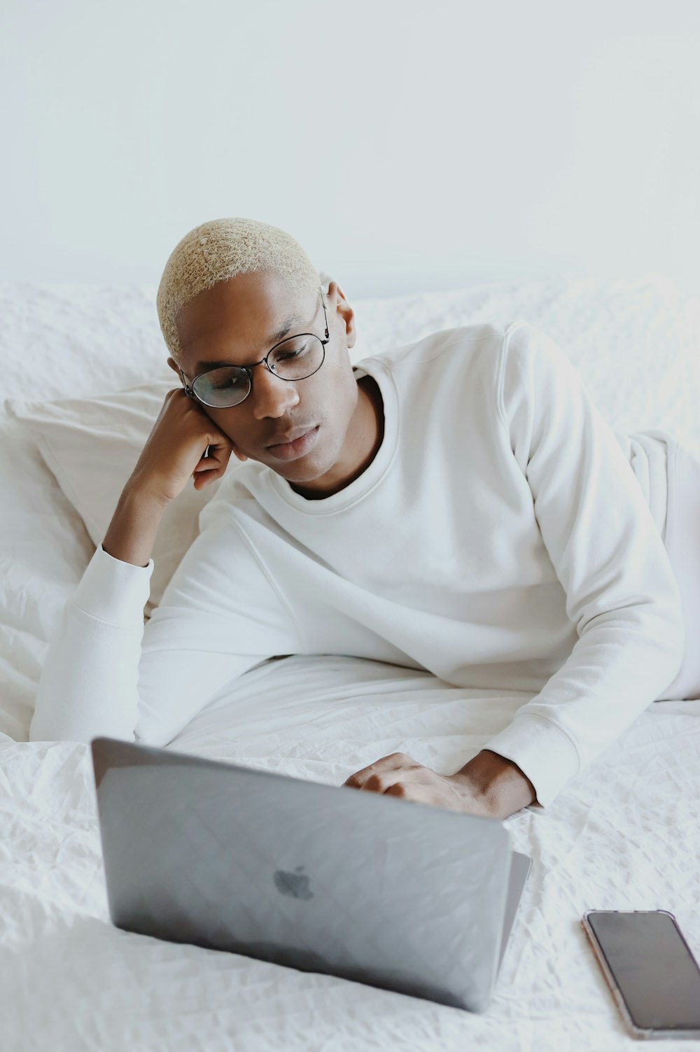 man in white long sleeve shirt wearing black framed eyeglasses