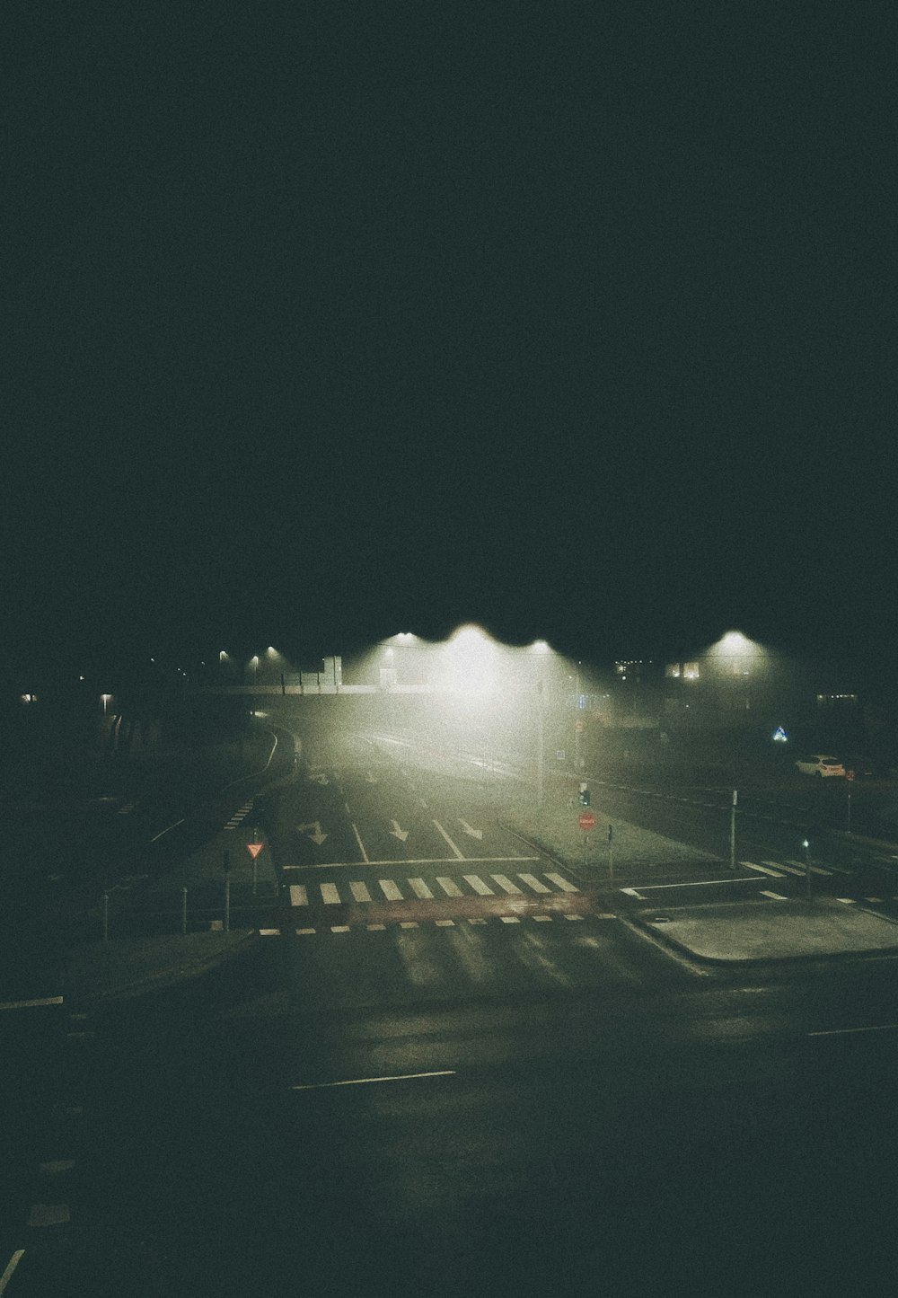 white car on road during night time