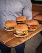 burger on brown wooden chopping board