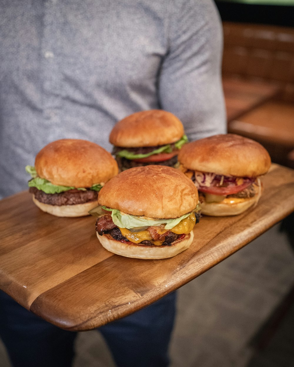 burger on brown wooden chopping board