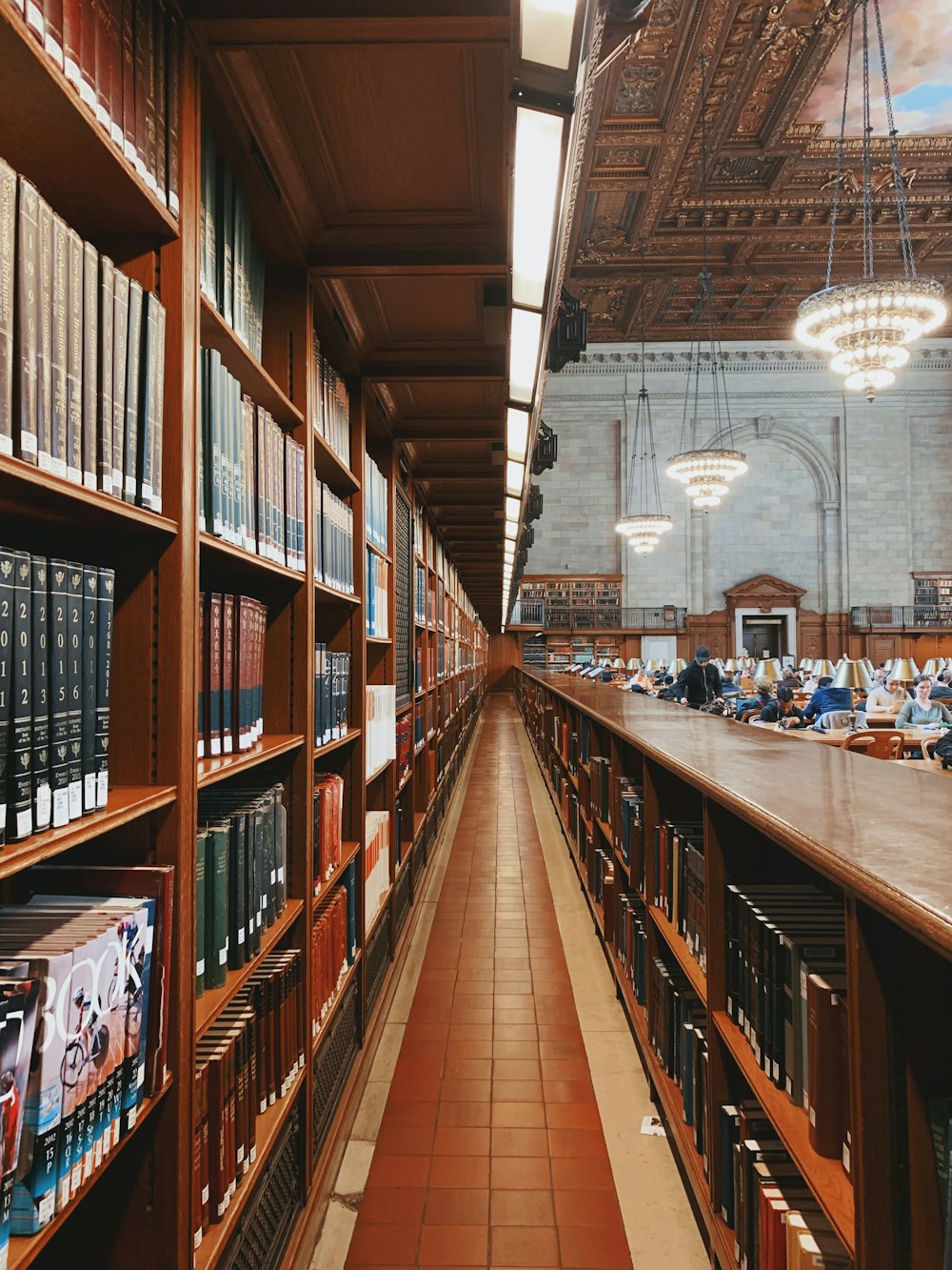 people sitting on chair inside library