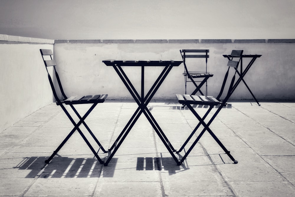 black metal folding chairs on gray concrete floor