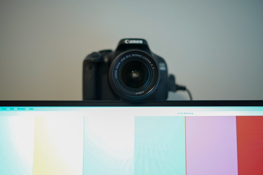 black nikon dslr camera on white table