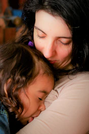 woman in white shirt lying on bed