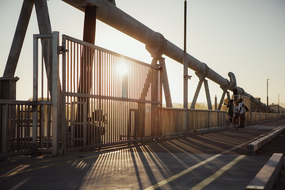 brown wooden bridge under white sky during daytime