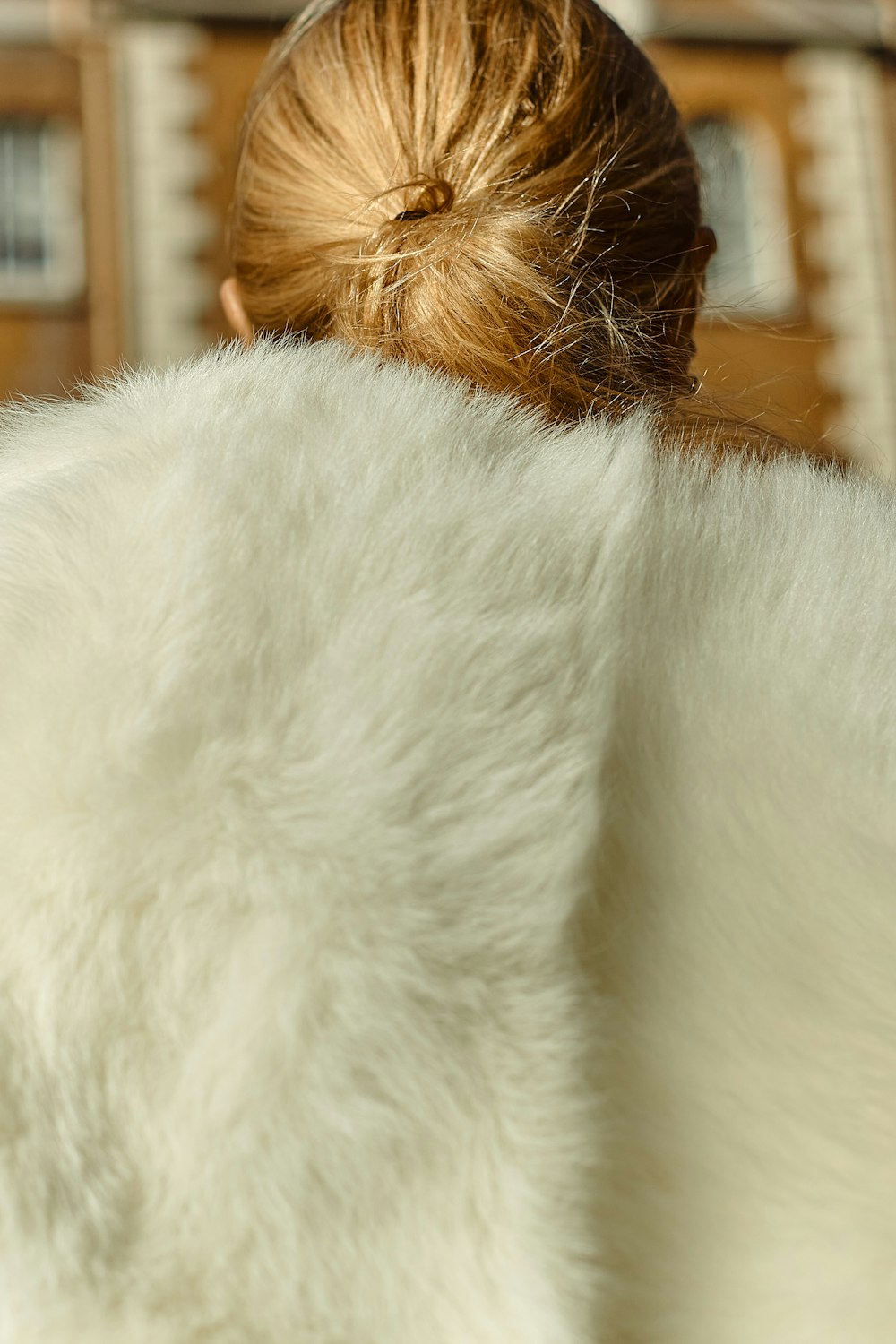 white fur textile on brown wooden table
