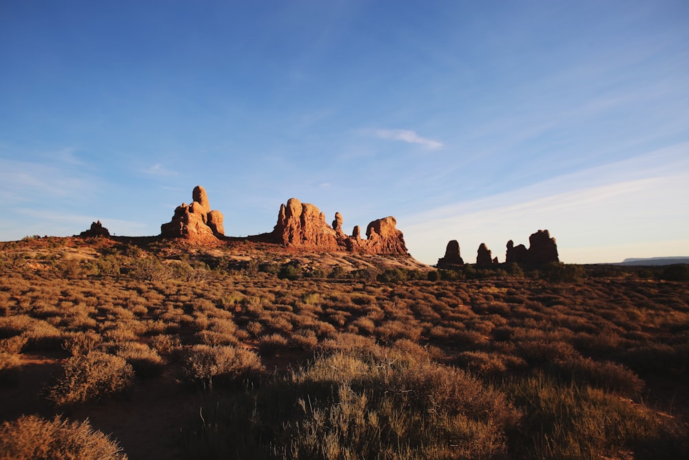 brown rock formation under blue sky during daytime