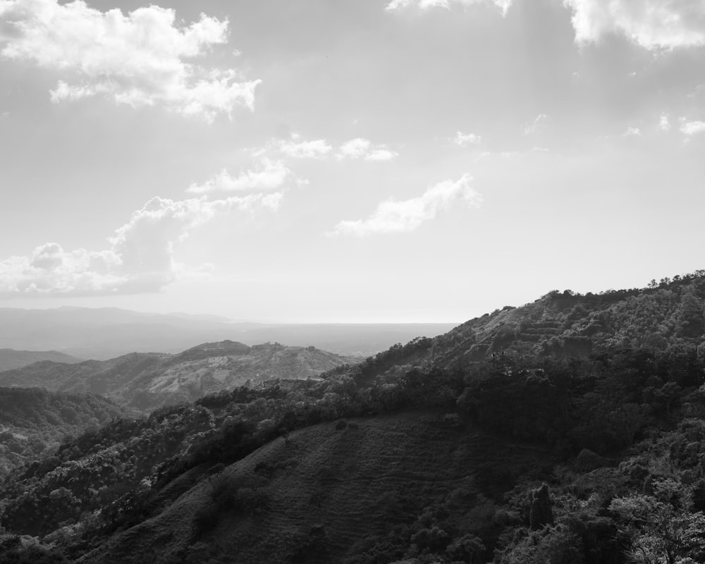 green and brown mountains under white clouds during daytime