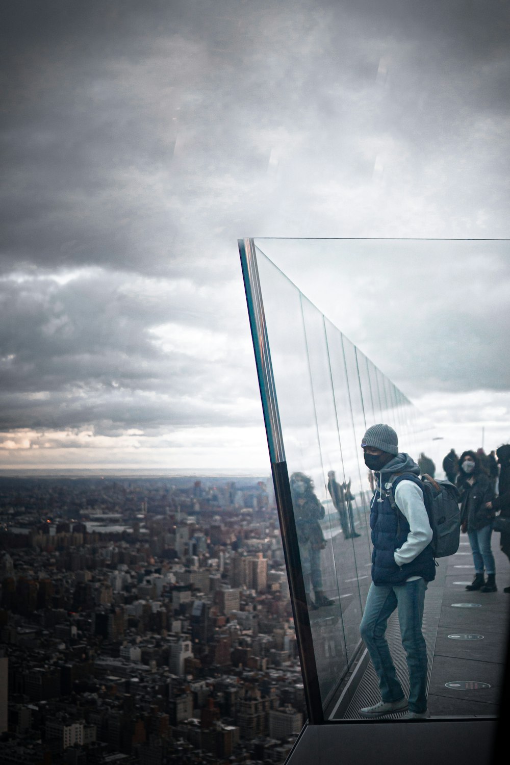 people standing on top of building during daytime