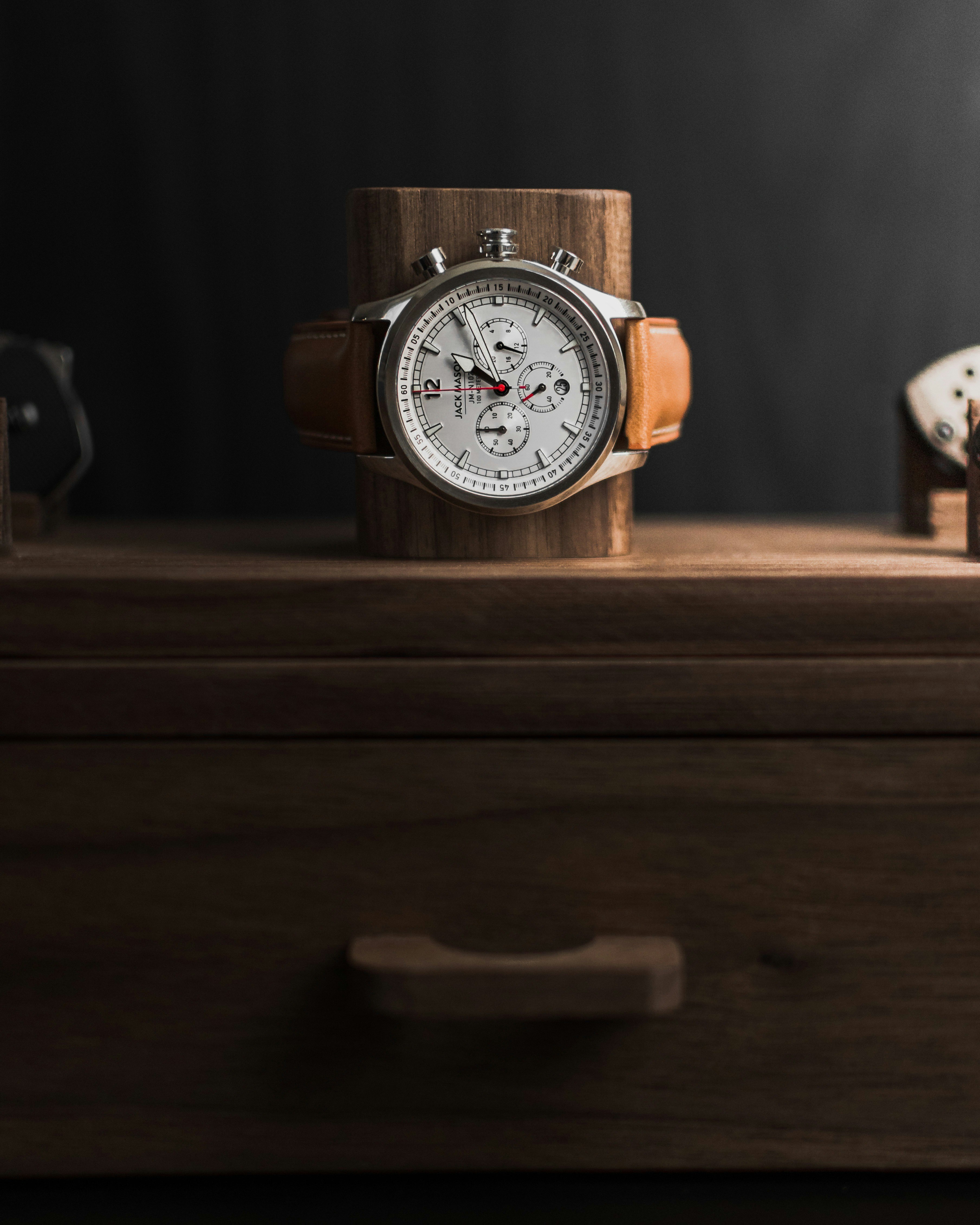 Brown and white analog watch at 10 10 photo Free Wristwatch Image on Unsplash