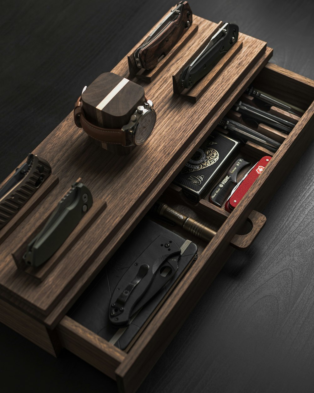 black and silver stapler on brown wooden shelf