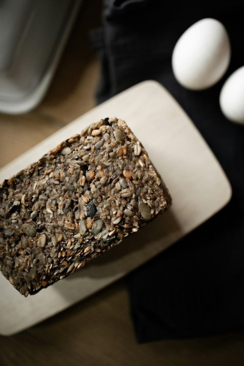 brown and black cake on white ceramic plate