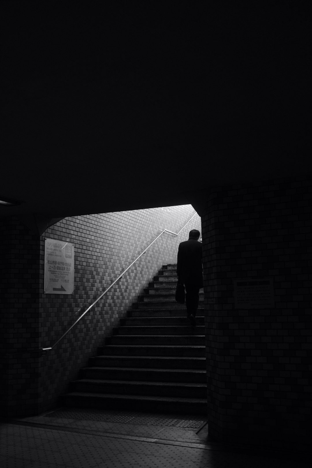 person walking on stairs during daytime