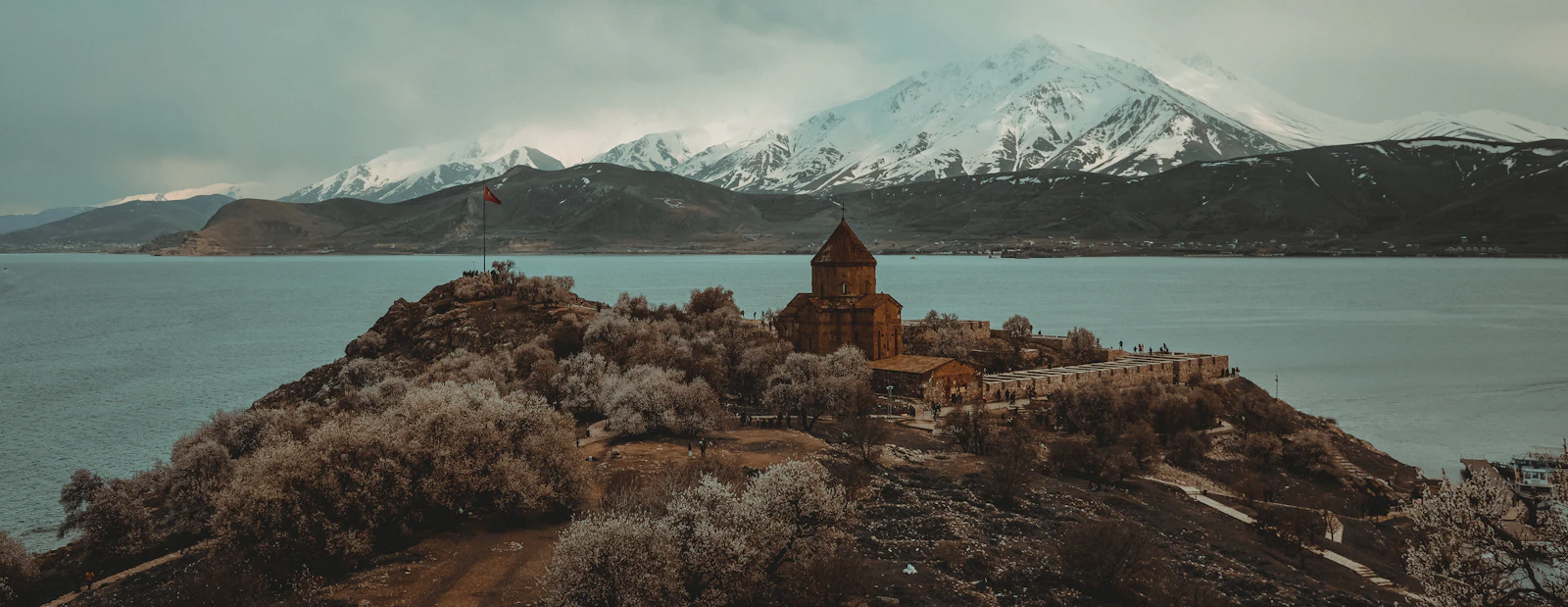 The Armenian church on Akdamar island in Lake Van, snow on the mountains beyond