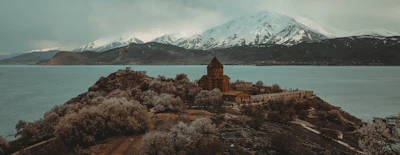 The Armenian church on Akdamar island in Lake Van, snow on the mountains beyond