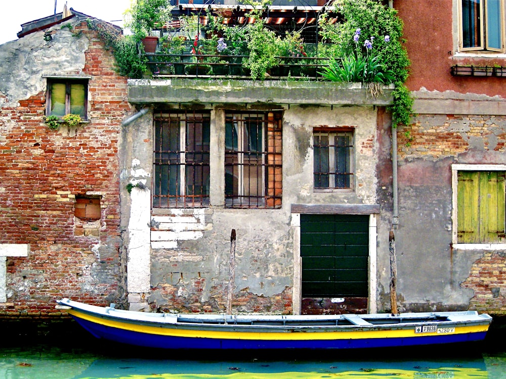 blue and yellow boat on water