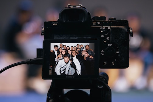 black dslr camera taking picture of 2 women