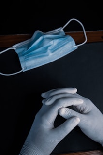 person holding blue textile on black table