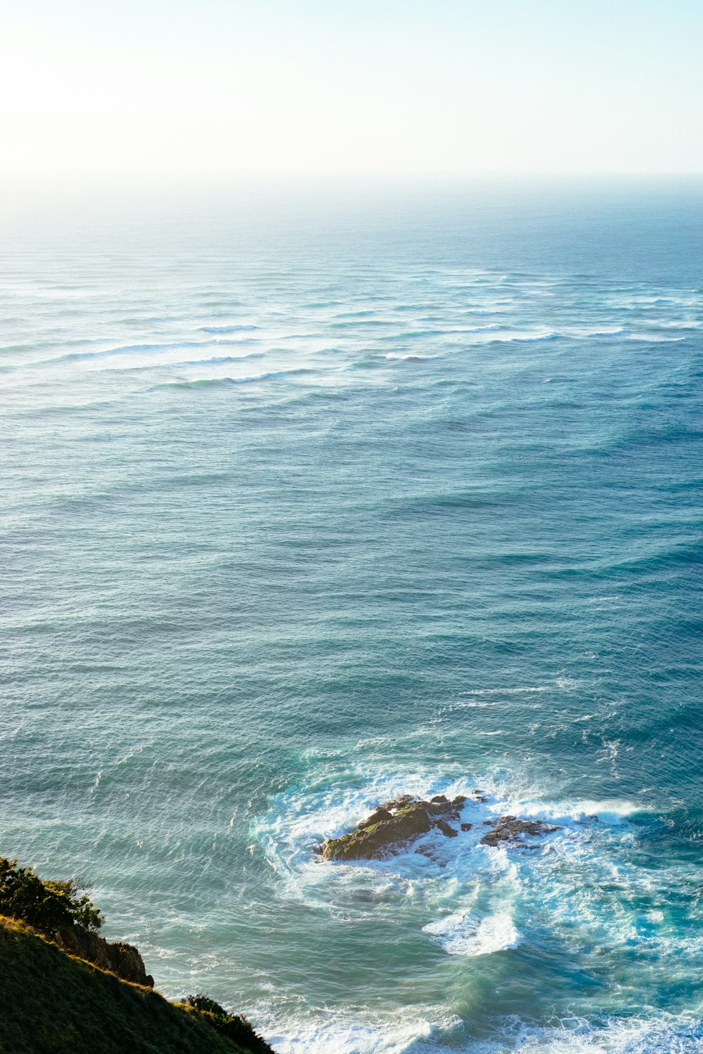 ocean waves crashing on shore during daytime