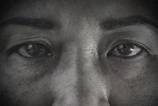 Close-up of a 3D scanner device capturing detailed contours of a person's face.