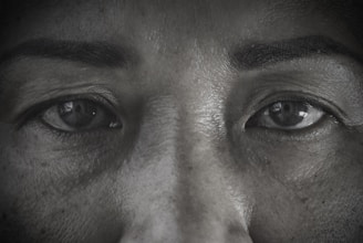 Close-up of a 3D character’s face showing fine details in skin texture and expressive eyes