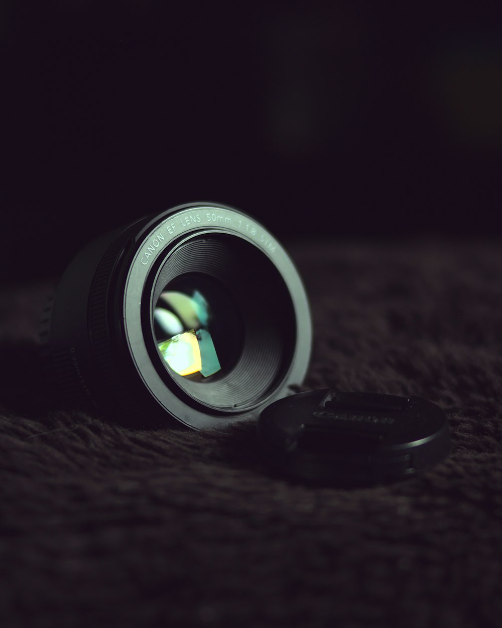 black camera lens on black textile