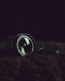 black camera lens on black textile